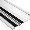 A close-up, angled view of a metal track with black rubber strips. Produktbild-Vorschau