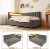 A dark gray upholstered daybed with a slatted base and integrated LED lighting in the headboard, shown in a bedroom setting. Below are two separate views of the daybed's frame, labeled 'Version 1' and 'Version 2'. Anteprima dell’immagine prodotto