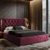 A bedroom scene featuring a burgundy upholstered bed with a tufted headboard. Produktbild-Vorschau