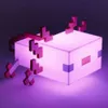 A glowing cube-shaped light with pixelated axolotl features attached. Anteprima dell’immagine prodotto