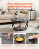 A round coffee table with a lower shelf, placed in a living room setting. Voir les images du produit