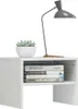 A white nightstand with books and a plant on top, next to a desk lamp. Náhľad obrázku produktu