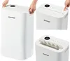 A collage of images showing a white dehumidifier with a digital display and controls. Anteprima dell’immagine prodotto