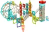 A marble run toy set with various colorful magnetic building blocks and transparent tubes, featuring a Ferris wheel-like mechanism and a castle tower. Náhled obrázku produktu