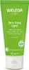 A green tube of Weleda Skin Food Light moisturizer with white text and a white cap, set against a white background. Voir les images du produit