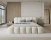 A modern bedroom with a large bed. Voir les images du produit