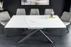 A dining table with chairs in a modern setting. Produktbild-Vorschau