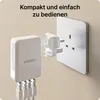 A white VOOMY travel adapter is shown plugged into a UK-style wall socket. The adapter has multiple USB ports visible. Voir les images du produit