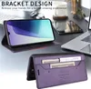 A desk with a laptop, phone case, and other office items. Produktbild-Vorschau