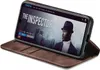 A smartphone in a brown flip case is displayed at an angle, showing a movie interface on the screen. Produktbild-Vorschau