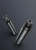 Two black cylindrical objects, one with prongs extending from the top, are placed on a dark gray background. Náhľad obrázku produktu