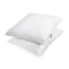 Two white pillows stacked on top of each other against a white background. Produktbild-Vorschau