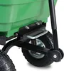 A close-up view of the wheel and frame of a green garden cart. Náhled obrázku produktu