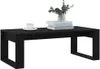 A black coffee table with a cup of coffee and a stack of books on it. Náhľad obrázku produktu