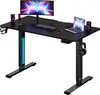 A black adjustable standing desk with a monitor, keyboard, mouse, laptop, and speakers on it. Anteprima dell’immagine prodotto