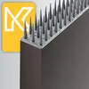 A close-up view of bird spikes mounted on a dark brown surface, with a yellow graphic featuring a white 'K' logo in the background. Náhľad obrázku produktu