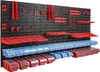 A wall-mounted storage system with various tool holders and bins. Náhled obrázku produktu