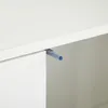 A close-up view of a push-to-open door mechanism on a white cabinet. Produktbild-Vorschau