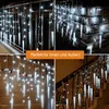 Collage of images showing white icicle string lights used for decoration indoors and outdoors, on a railing, on a brick wall, and on stairs. Produktbild-Vorschau