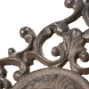 A close-up view of an ornate, antique-style metal rosette, likely part of a garden faucet or decorative fixture. Voir les images du produit