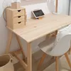 A wooden desk with a small drawer unit, a tablet on a stand, and a white chair. Anteprima dell’immagine prodotto