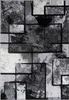 A close-up, top-down view of a rug with an abstract geometric pattern in shades of gray and black. Produktbild-Vorschau