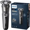 A Philips electric shaver and its packaging are displayed. Náhled obrázku produktu
