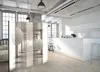 A modern, minimalist interior with a white kitchen and a decorative room divider. Produktbild-Vorschau