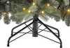 Close-up of the base and lower branches of an artificial Christmas tree with lights. Produktbild-Vorschau