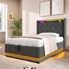 A bedroom setting with a bed, plant, and artwork. Produktbild-Vorschau