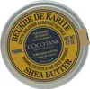 A top-down view of a L'Occitane Shea Butter tin. Voir les images du produit