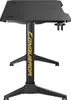 A black gaming desk with gold accents is shown from a side angle. Produktbild-Vorschau