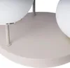 A close-up view of the base and lower stems of a multi-headed lamp. Produktbild-Vorschau