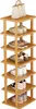 A wooden shoe rack with several shelves filled with shoes and a handbag on top. Produktbild-Vorschau