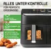 A black air fryer with food inside, accompanied by marketing text and icons. Produktbild-Vorschau