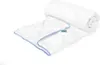 A white duvet with blue trim is rolled up and partially unrolled, lying on a white surface. Produktbild-Vorschau