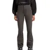 A person wearing ski pants and a hoodie. Produktbild-Vorschau