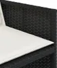 A close-up view of a black rattan sofa with a white cushion. Náhľad obrázku produktu