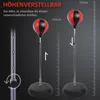 A punching ball set with adjustable height, shown in two different height configurations. Produktbild-Vorschau