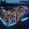 A complex wooden mechanical model, possibly a marble run, with intricate gears and tracks, illuminated by blue LED lights against a dark, futuristic background. Podgląd zdjęcia produktu