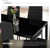 A close-up view of a modern black dining table and chairs with a floral arrangement on the table, featuring marketing text and a brand logo at the bottom. Náhled obrázku produktu