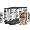 A black metal dog crate with its doors open, and a small Yorkshire Terrier dog sitting in front of it. Podgląd zdjęcia produktu