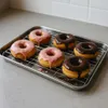 Donuts on a baking rack on a countertop. Anteprima dell’immagine prodotto