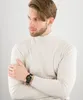 A man wearing a turtleneck and a watch. Produktbild-Vorschau
