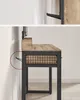 Close-up side view of a desk with metal frame and wood top. A dashed red circle highlights a hook on the side. Náhled obrázku produktu