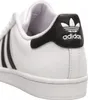 A close-up view of the heel and side of a white Adidas sneaker with black accents. Podgląd zdjęcia produktu