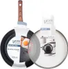 A frying pan and a pot lid are displayed against a white background. The frying pan has a black speckled surface and a wooden handle. The pot lid is transparent glass with a metal rim and a black knob. Packaging for both items is visible. Náhľad obrázku produktu