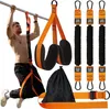 A man is using resistance bands attached to a pull-up bar for exercise. Several other resistance bands and a storage bag are also visible. Náhled obrázku produktu