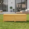 A wooden storage box sits on a green lawn in front of a modern house. Podgląd zdjęcia produktu