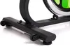 Close-up of the base of a fitness machine, showing the wheels and stabilizers. Podgląd zdjęcia produktu